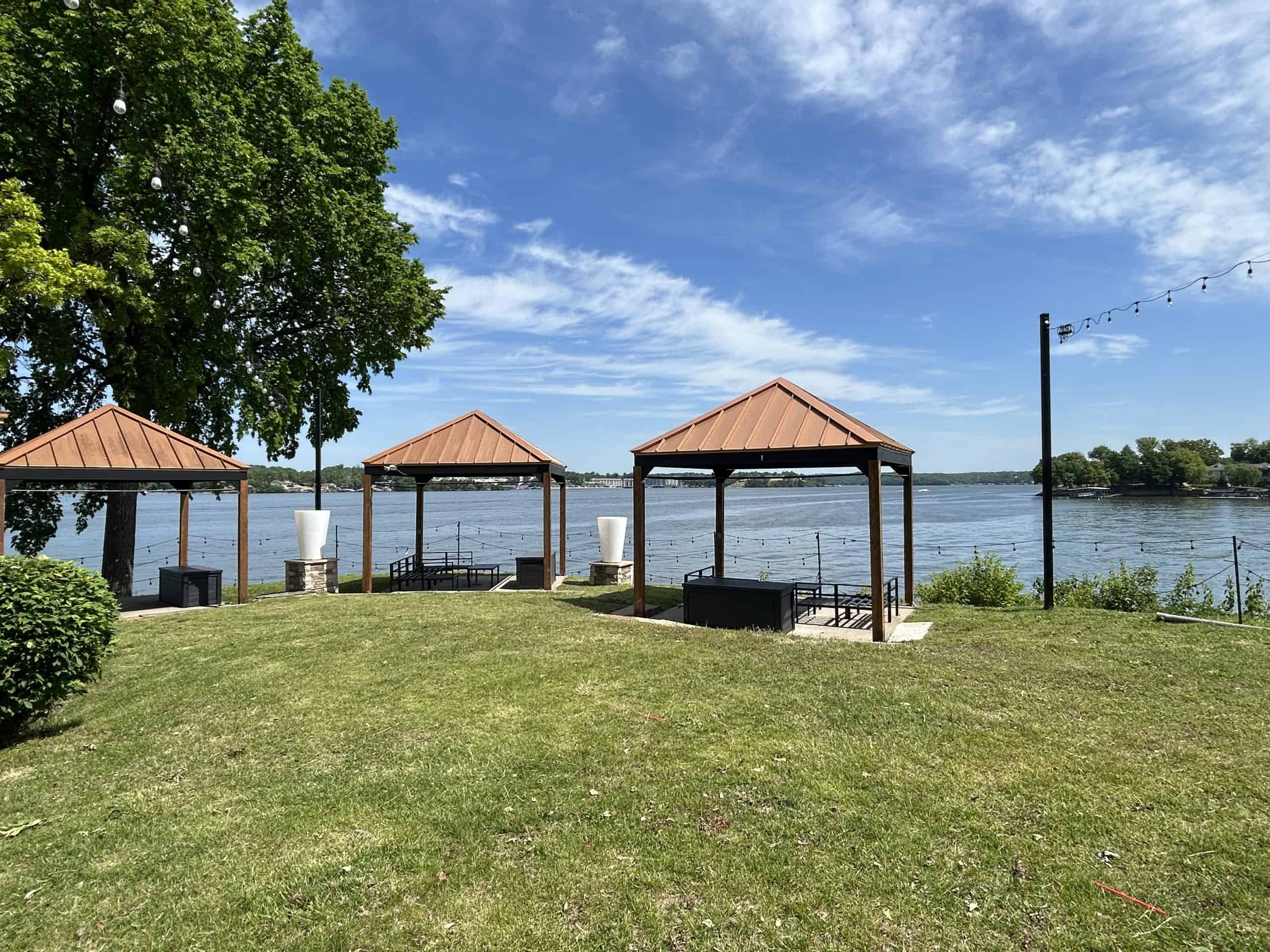 cabanas and grass in front of Lake of the Ozarks