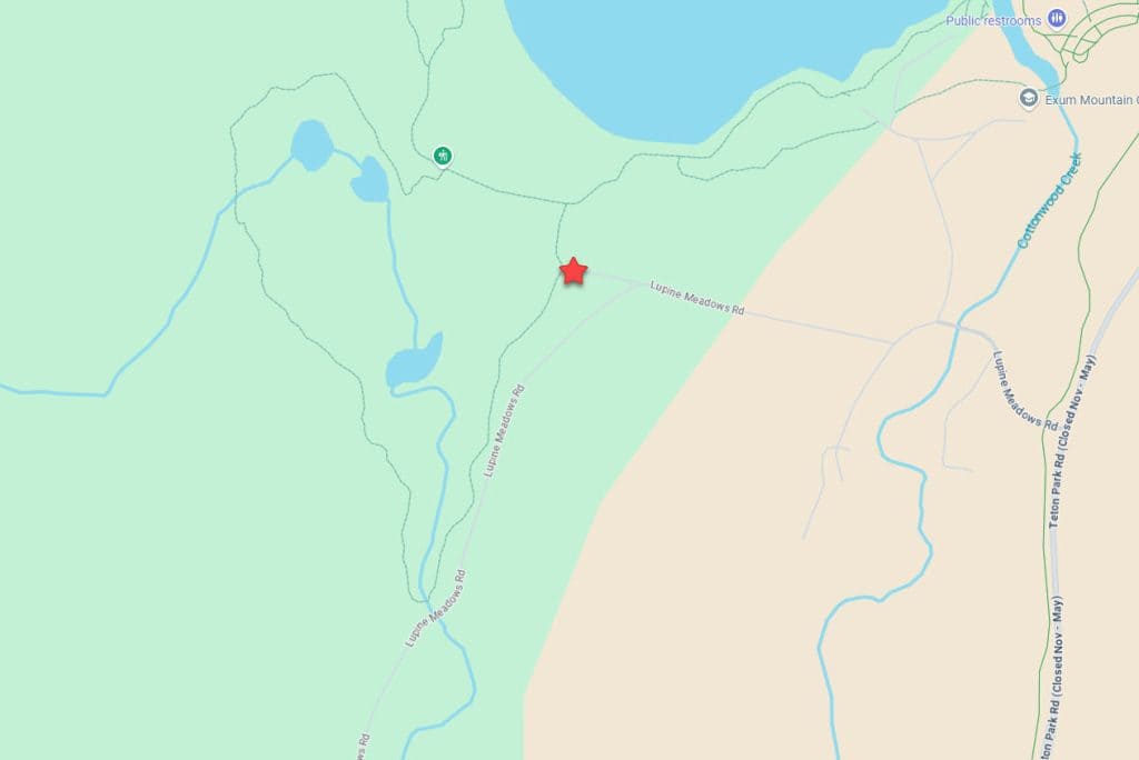 Map showing Lupine Meadows Road in a forested area, with a red star marking a location near trail access and small lakes. 
