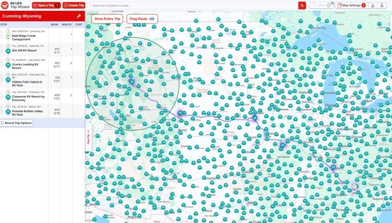 Trip planning map showing an RV route from Cumming, Georgia to Moran, Wyoming, with stops at campgrounds in Tennessee, Missouri, Nebraska, and Cheyenne, Wyoming. The map is covered with icons marking campgrounds, and a purple line traces the planned travel path across multiple states.